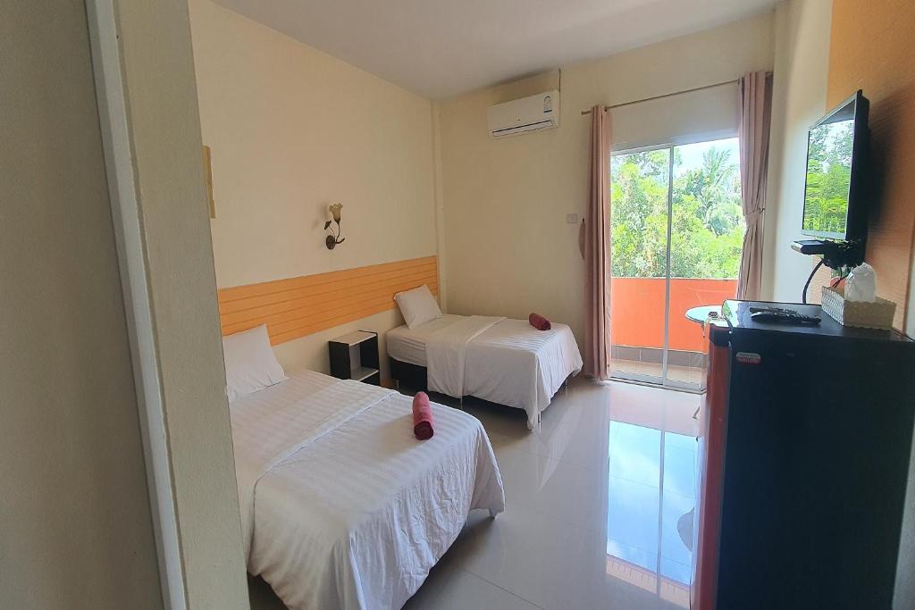 Postel nebo postele na pokoji v ubytování M Resort