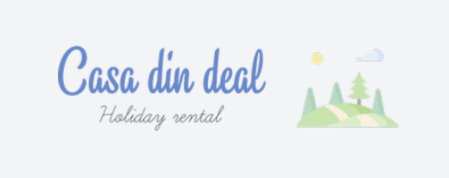 a sign for a casa sanibel holiday rental at Casa Din Deal in Podişu