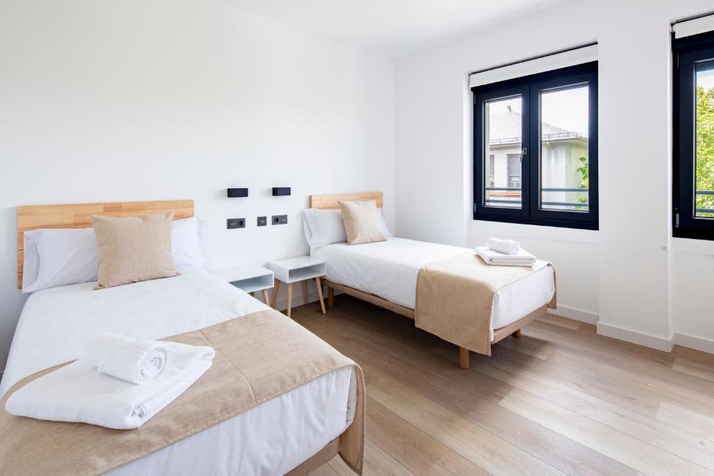 Ένα ή περισσότερα κρεβάτια σε δωμάτιο στο Apartamentos Turísticos D10