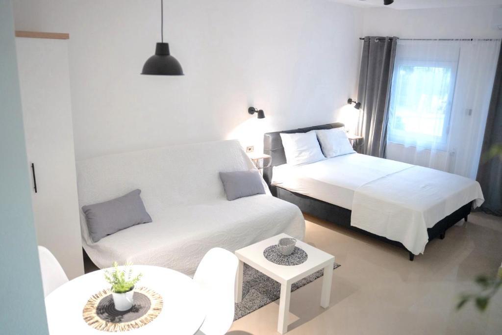 Postel nebo postele na pokoji v ubytování LAGUNA Apartments