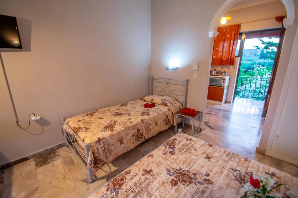 Postel nebo postele na pokoji v ubytování Avouris Studios