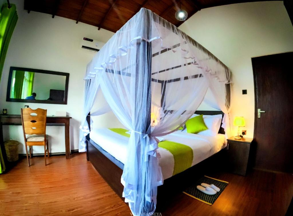 Postel nebo postele na pokoji v ubytování Villa Sanseya Kandy