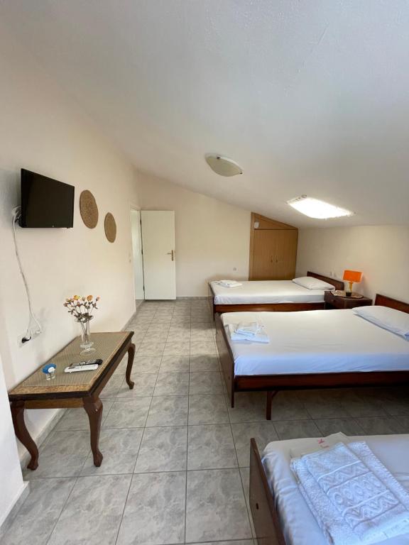 Postel nebo postele na pokoji v ubytování Aktaion Hotel