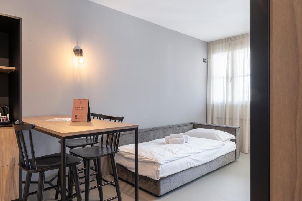Postel nebo postele na pokoji v ubytování Residence - Palais Hörtenberg