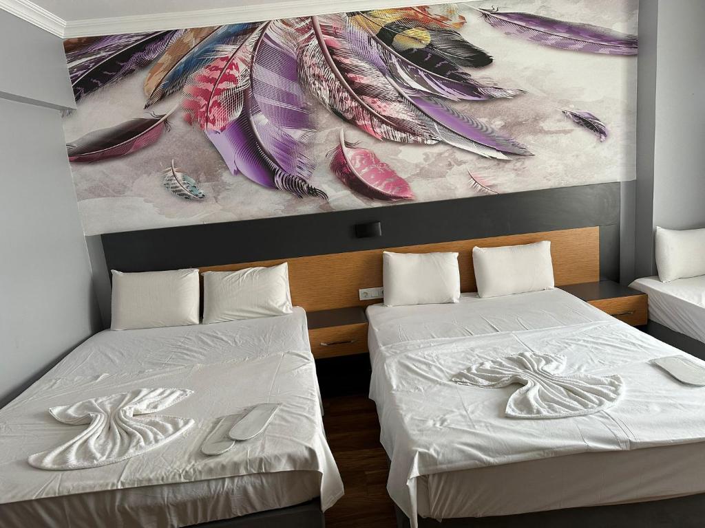 A bed or beds in a room at Hotel Otağ