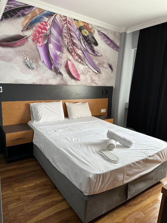 A bed or beds in a room at Hotel Otağ