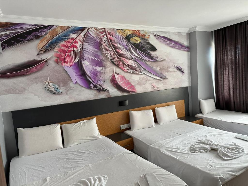 A bed or beds in a room at Hotel Otağ
