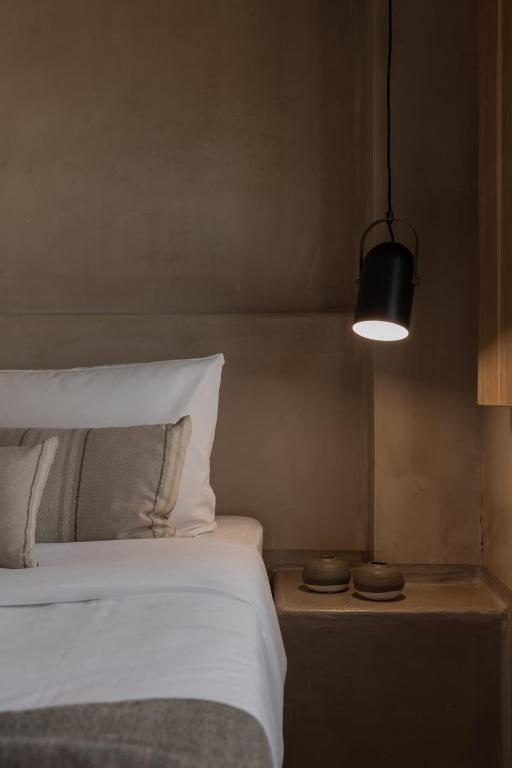 Postel nebo postele na pokoji v ubytování Momi Slow Living Hotel