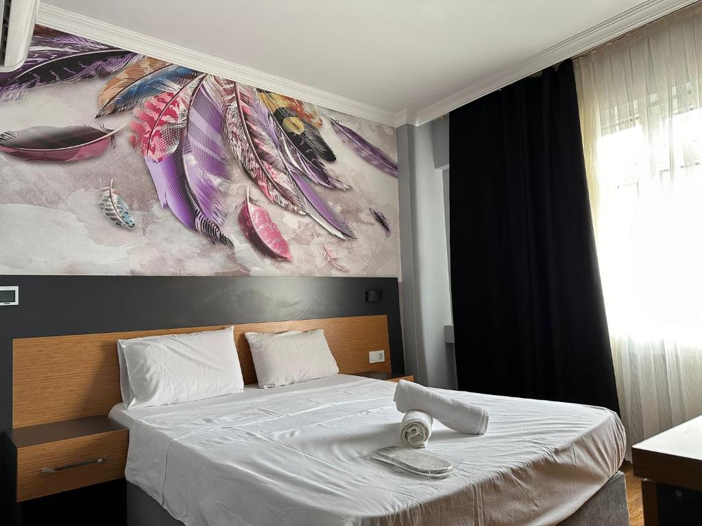 A bed or beds in a room at Hotel Otağ