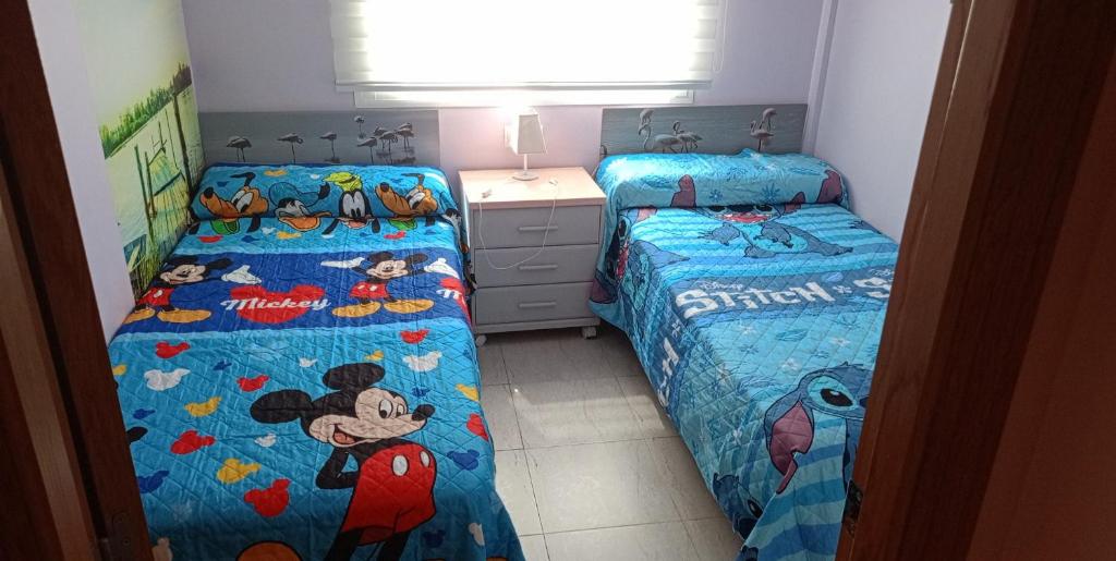 Posteľ alebo postele v izbe v ubytovaní Apartamento, en pueblo pesquero
