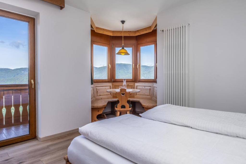 Postel nebo postele na pokoji v ubytování Hotel Tirol- Natural Idyll
