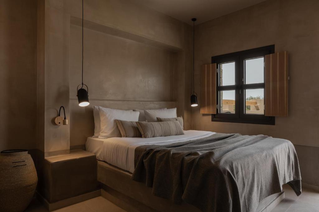 Postel nebo postele na pokoji v ubytování Momi Slow Living Hotel