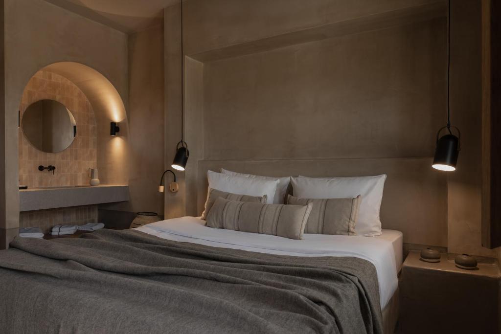 Postel nebo postele na pokoji v ubytování Momi Slow Living Hotel