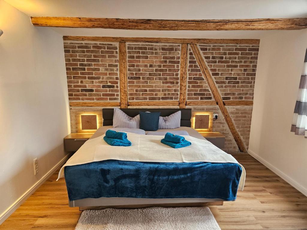 Postel nebo postele na pokoji v ubytování Ferienwohnung zu den Ilsefällen I