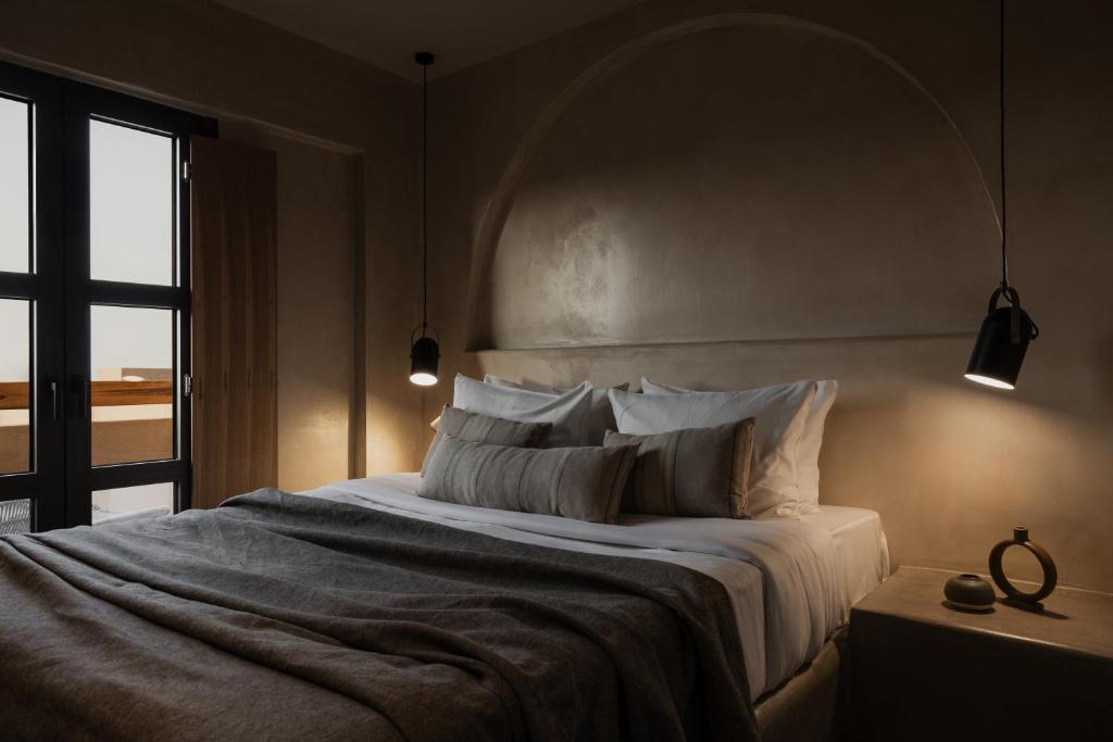 Postel nebo postele na pokoji v ubytování Momi Slow Living Hotel