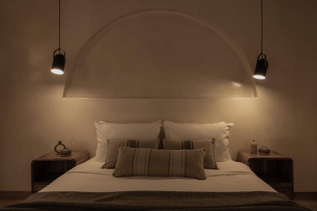 Postel nebo postele na pokoji v ubytování Momi Slow Living Hotel
