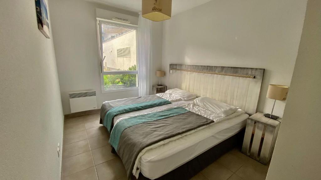 Postel nebo postele na pokoji v ubytování T2 avec piscine en résidence 4 étoiles