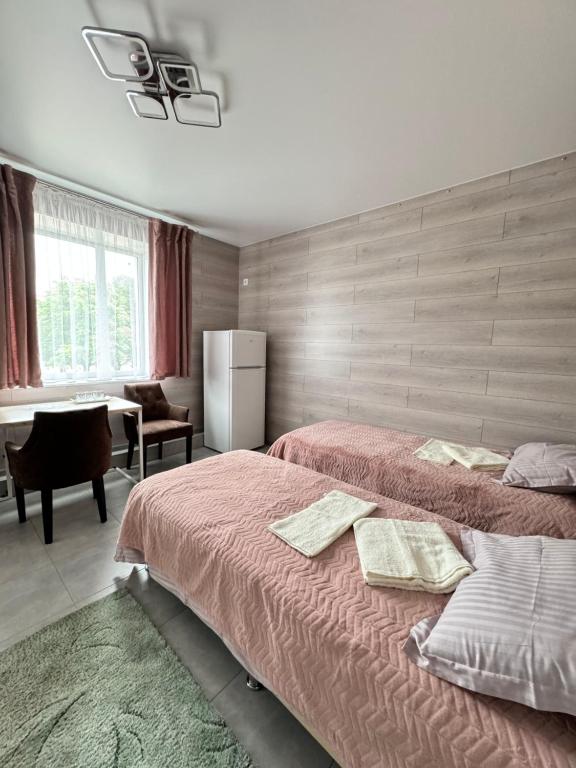 Postel nebo postele na pokoji v ubytování Hotel TETRIS Voznesensk