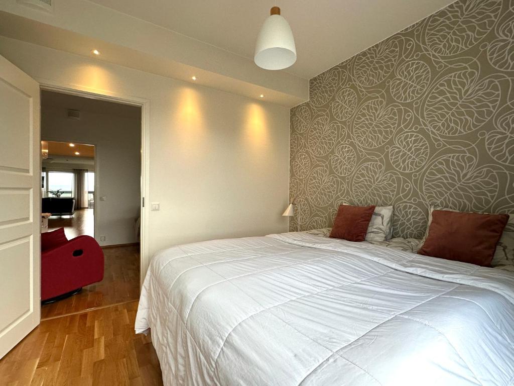 Postel nebo postele na pokoji v ubytování Aurora Sky Apartment
