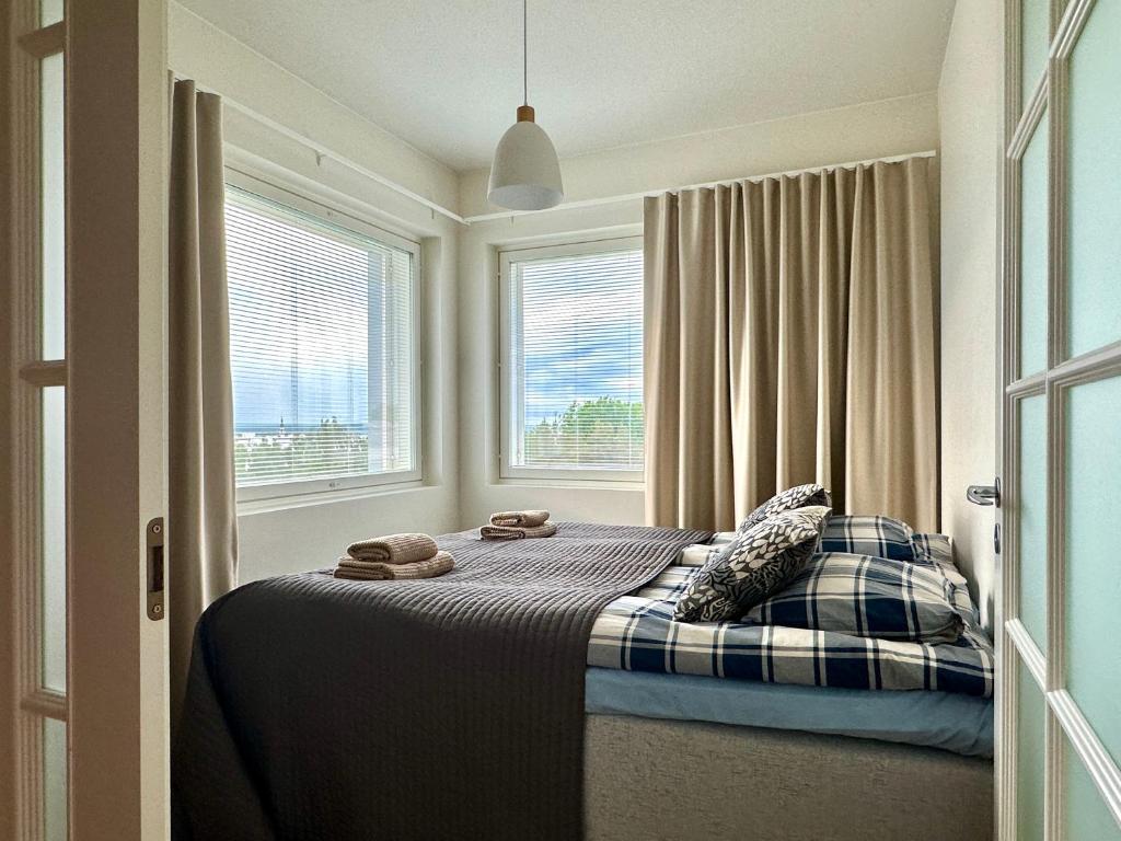 Postel nebo postele na pokoji v ubytování Aurora Sky Apartment