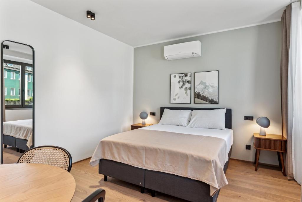 Postel nebo postele na pokoji v ubytování limehome Bad Hall Hauptplatz