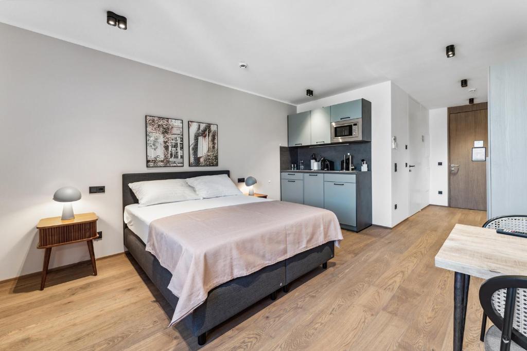 Postel nebo postele na pokoji v ubytování limehome Bad Hall Hauptplatz