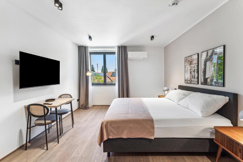 Postel nebo postele na pokoji v ubytování limehome Bad Hall Hauptplatz