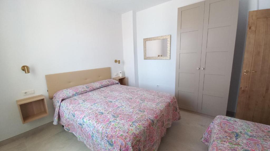 Łóżko lub łóżka w pokoju w obiekcie Casa Cuartel El Delfín