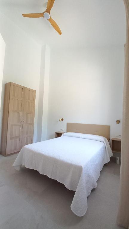 Łóżko lub łóżka w pokoju w obiekcie Casa Cuartel El Delfín