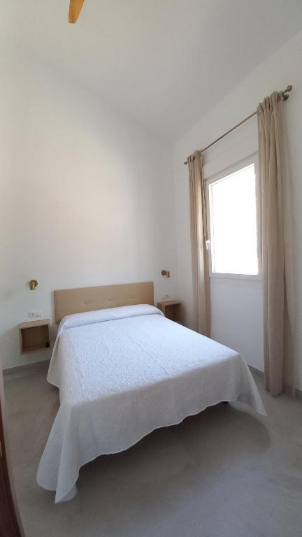 Łóżko lub łóżka w pokoju w obiekcie Casa Cuartel El Delfín