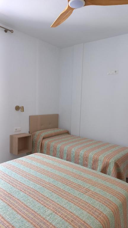 Łóżko lub łóżka w pokoju w obiekcie Casa Cuartel El Delfín