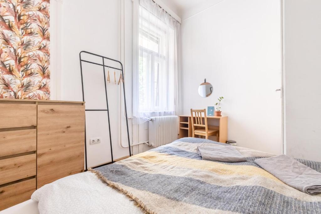 Posteľ alebo postele v izbe v ubytovaní Gellerico Rooms at Horánszky Street