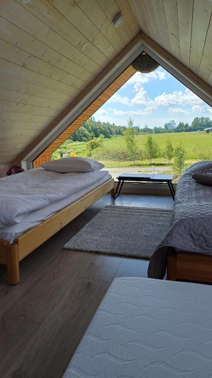 Postel nebo postele na pokoji v ubytování Pieni Mökki