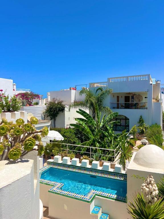 a view of a building with a swimming pool at RIAD OASIS D'ASILAH in Asilah