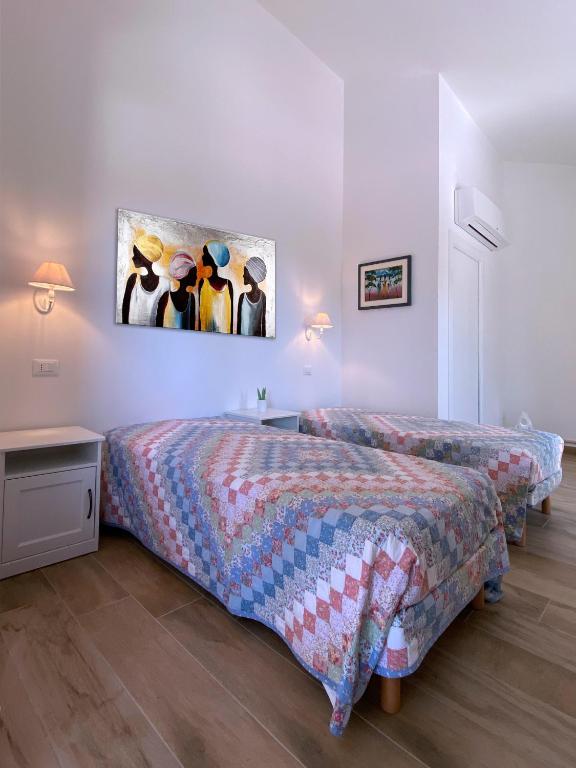 Postel nebo postele na pokoji v ubytování Le Tre Lune B&B