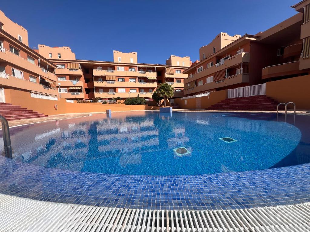 a large swimming pool in the middle of a building at OBSIDIAN Aguamarina in Puertito de Güímar