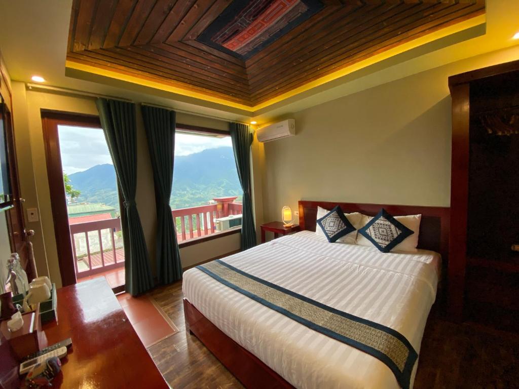 Postel nebo postele na pokoji v ubytování Botanic Sapa Hotel