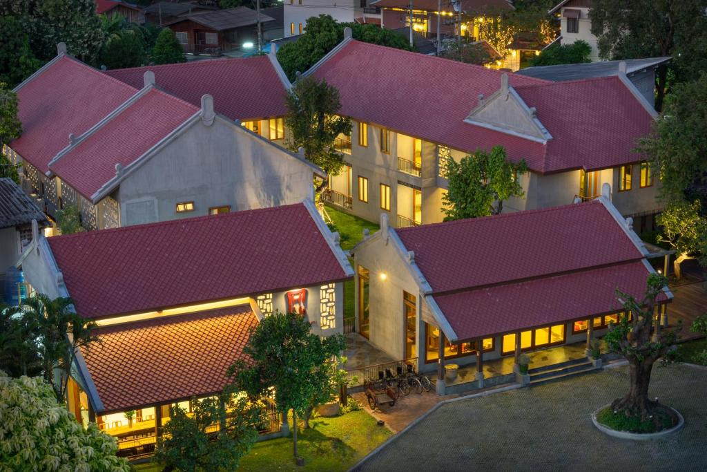 an overhead view of a building with purple roofs at Chu Hotel in Chiang Mai