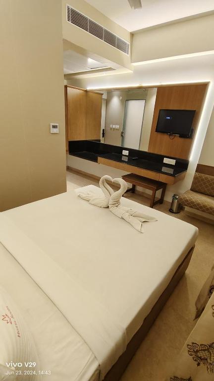 Postel nebo postele na pokoji v ubytování Hotel Roopa