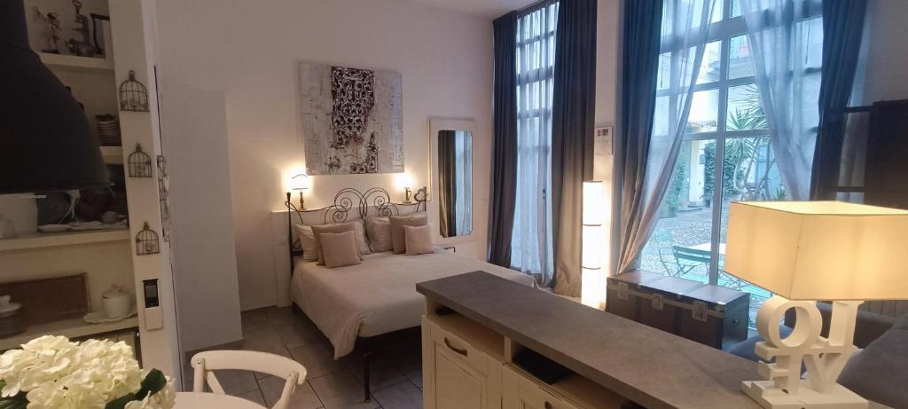 a bedroom with a bed and a large window at Carducci in Como