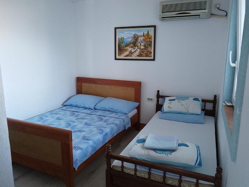 Postel nebo postele na pokoji v ubytování Apartmanes Volaric M