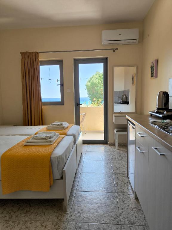 Kuchyň nebo kuchyňský kout v ubytování Alexia Rooms