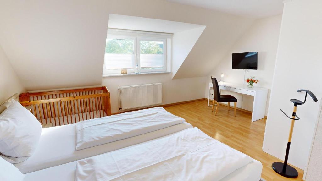 Postel nebo postele na pokoji v ubytování Appartementhaus Sir Henry Sir Henry Wohnung C