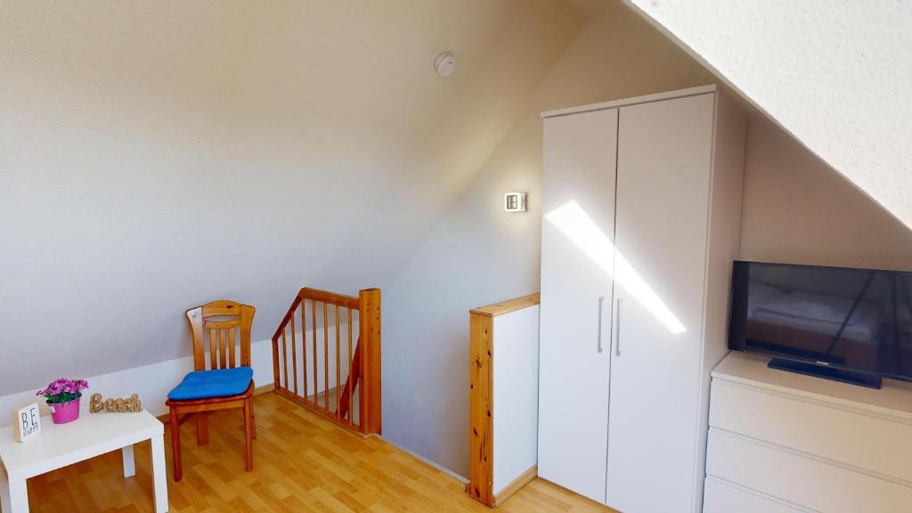TV a/nebo společenská místnost v ubytování Appartementhaus Sir Henry Sir Henry Wohnung C