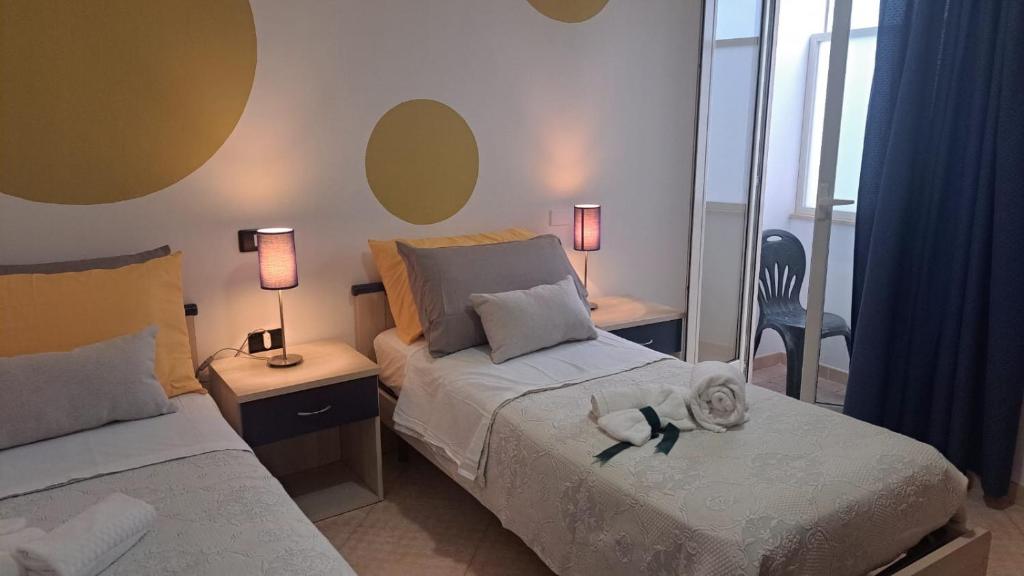 Postel nebo postele na pokoji v ubytování MariMare B&B