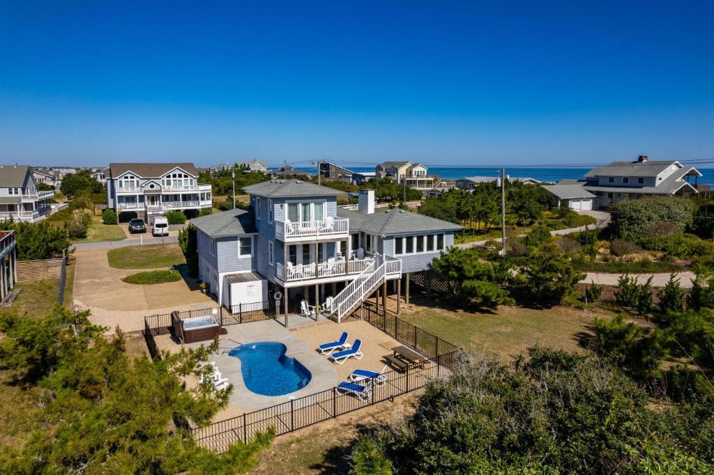 an aerial view of a house with a pool at SH125 Here & Now in Southern Shores