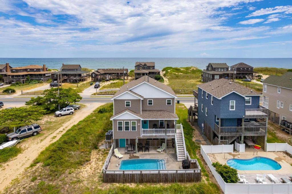 an aerial view of a house and the ocean at NH380 Pelican View in Nags Head