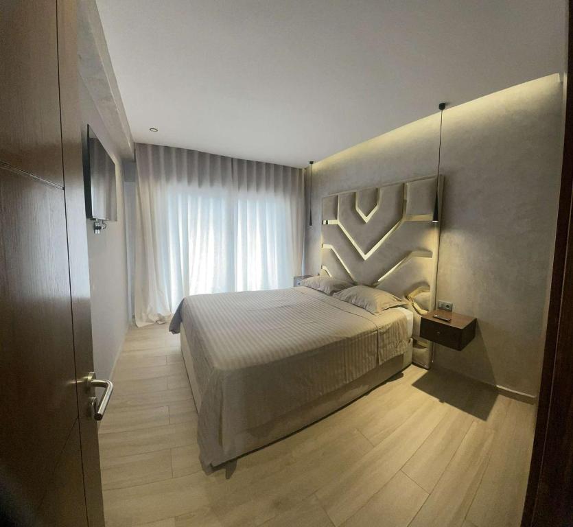 Postel nebo postele na pokoji v ubytování Appartement vue sur Tower Hassan