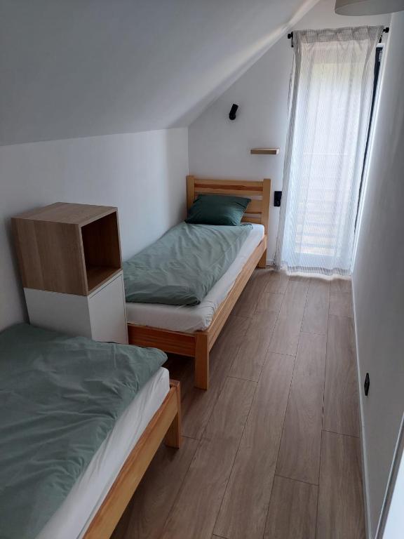 Posteľ alebo postele v izbe v ubytovaní Przytullas - Domki na Mazurach