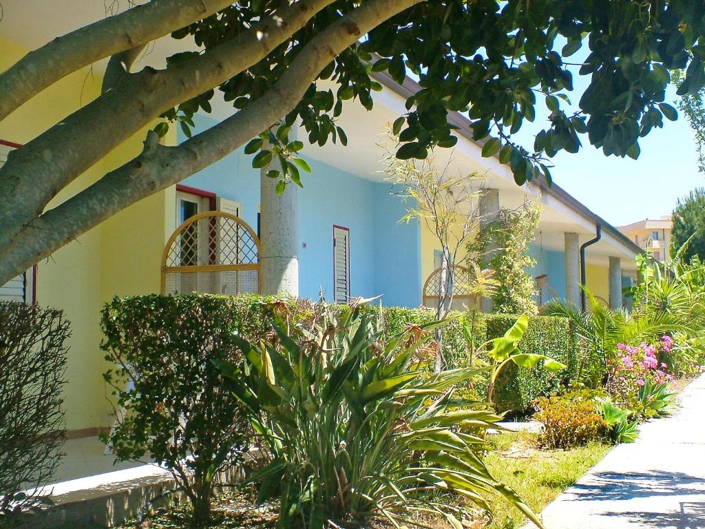 a house with a garden with plants and trees at Apartment Dependance-2 by Interhome in Santa Maria